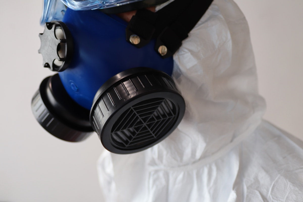 Yoor_Air_HVAC_air_filters_Change_your_air_filter_damnit_image of human with gas mask on and white hazmat suit